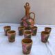 Old carafe with 8 ceramic glasses