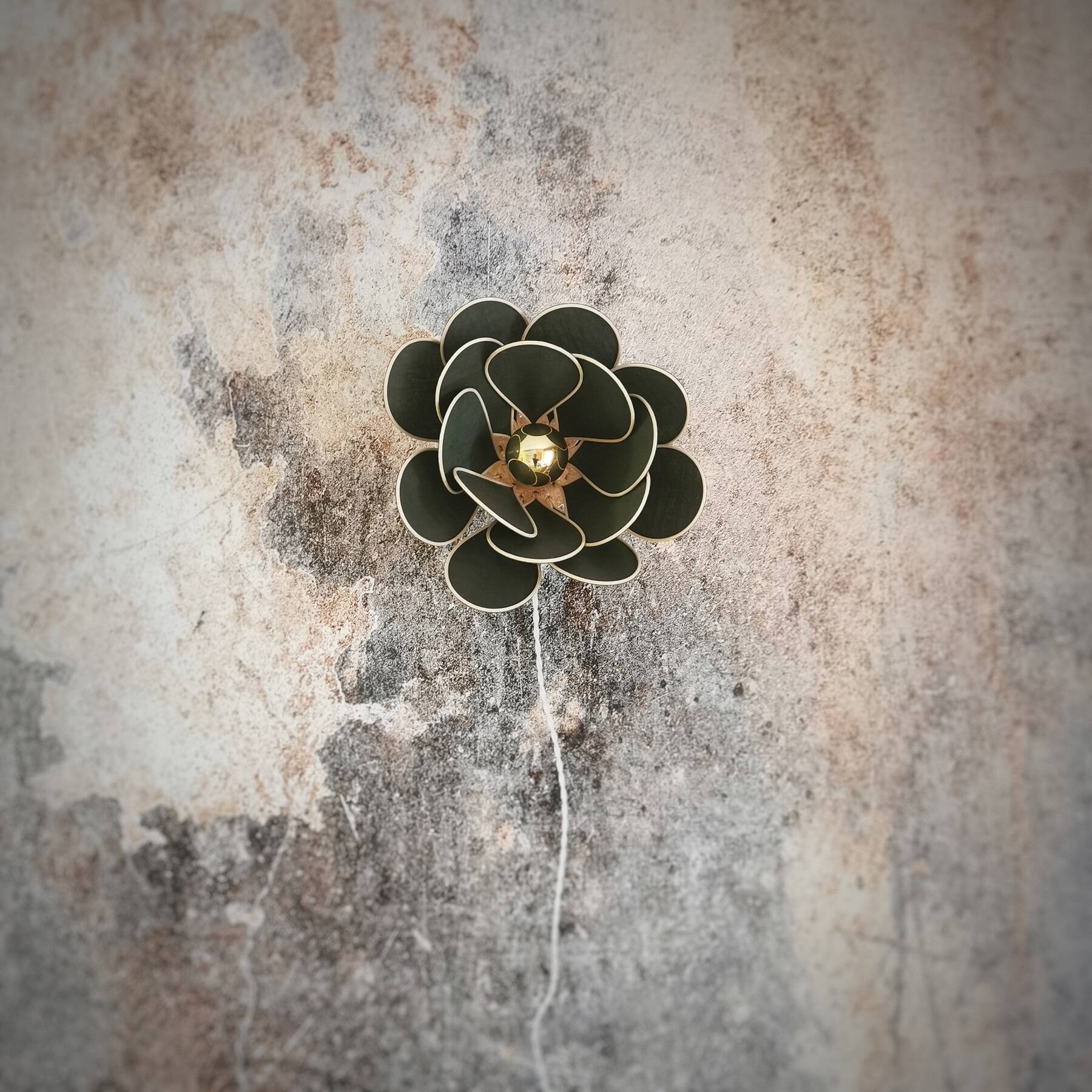 Wall lamp flower made of rattan and fir green linen.