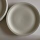 Set of 7 Scandinavian modernist flat plates in ivory earthenware