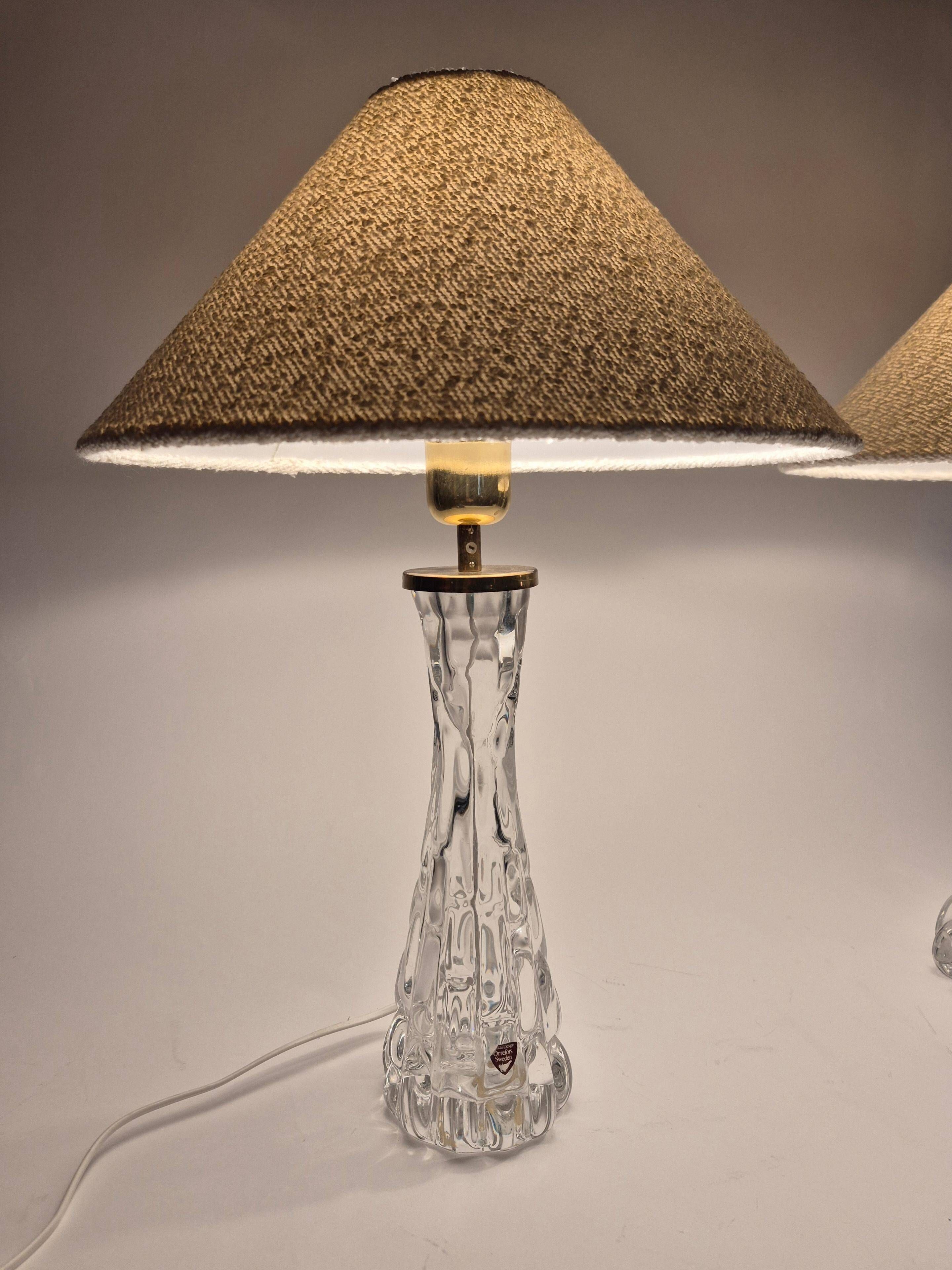 Elegant pair of table lamps The Modern Scandinavian Modern with Orrefors glass and brass.
