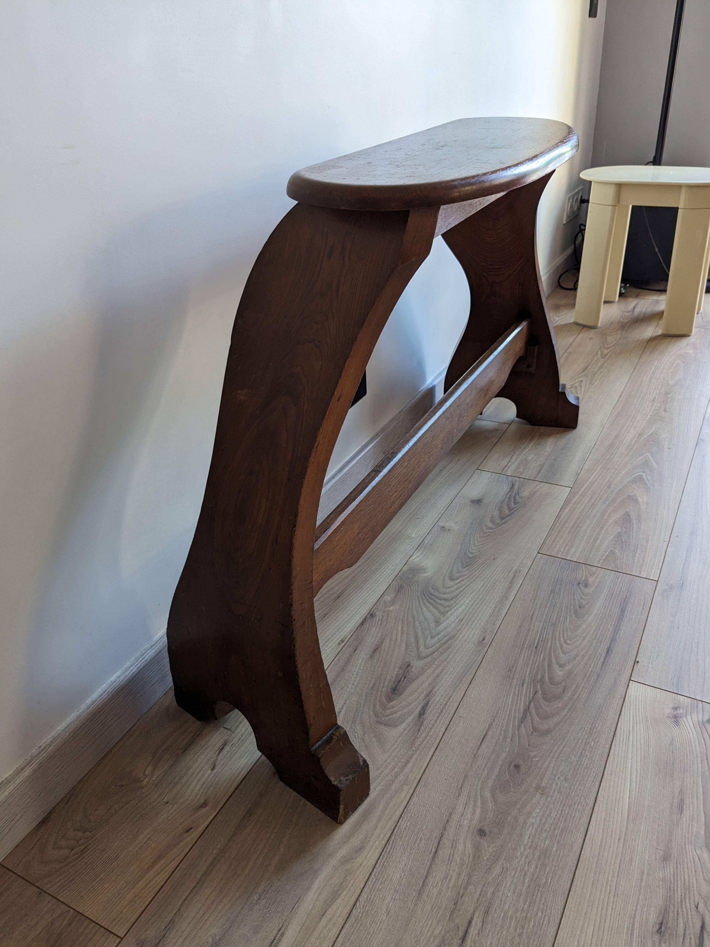 Old church organ bench in Art Nouveau style made of solid oak.