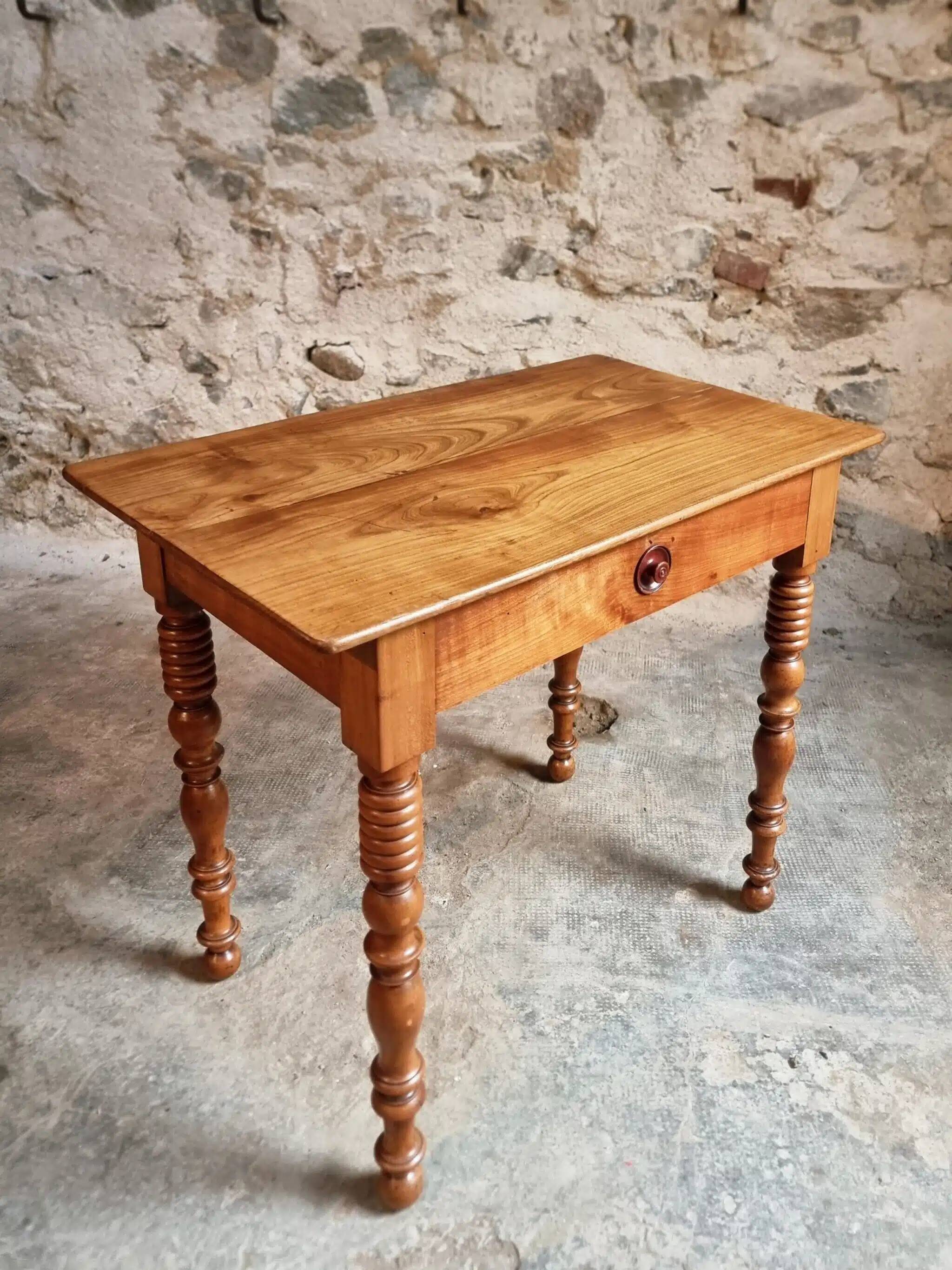 Small antique French writing table in walnut with a drawer, around 1900.