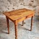 Small antique French writing table in walnut with a drawer, around 1900.