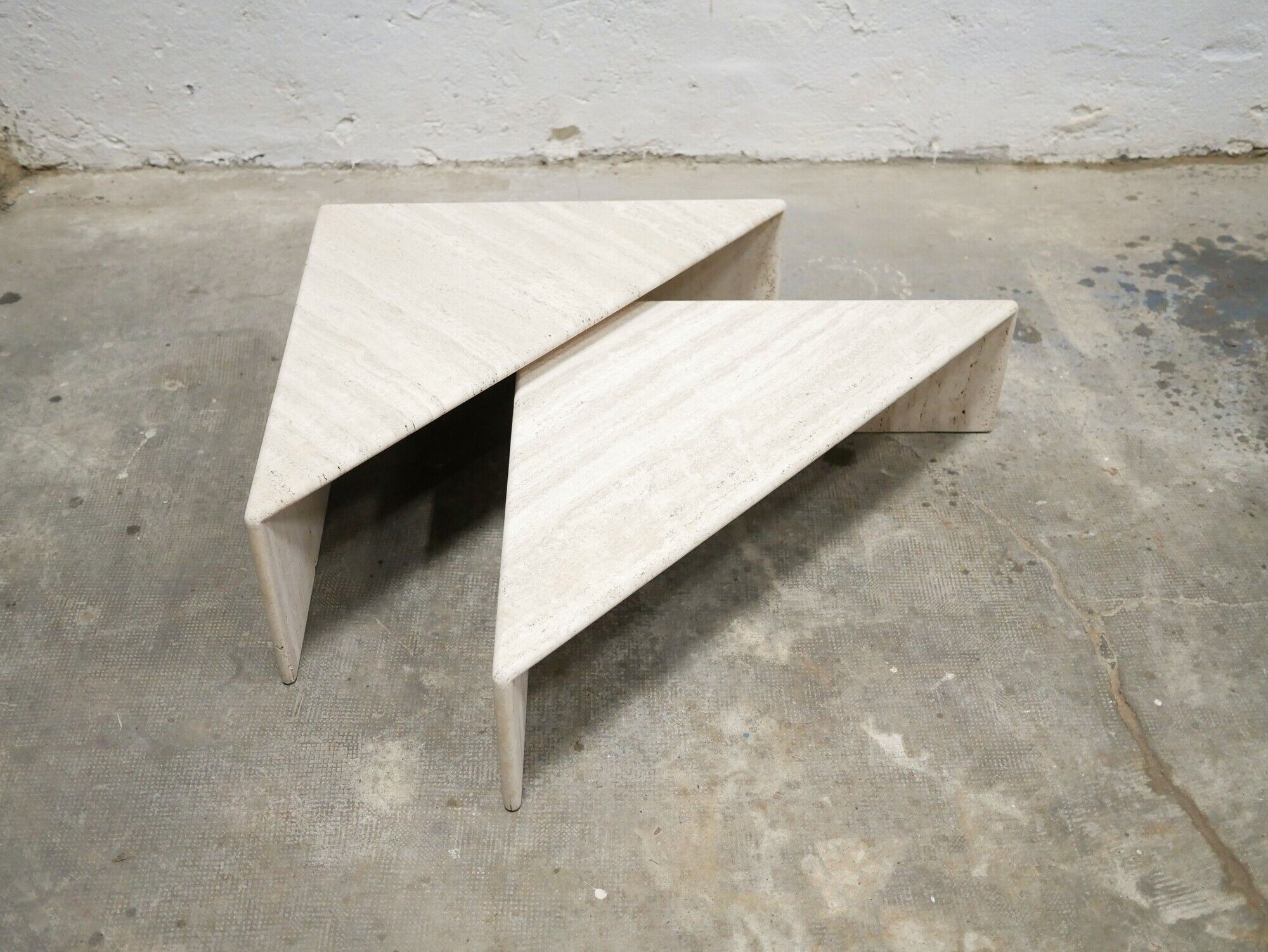 Series of 2 vintage travertine coffee tables published by Roche Bobois