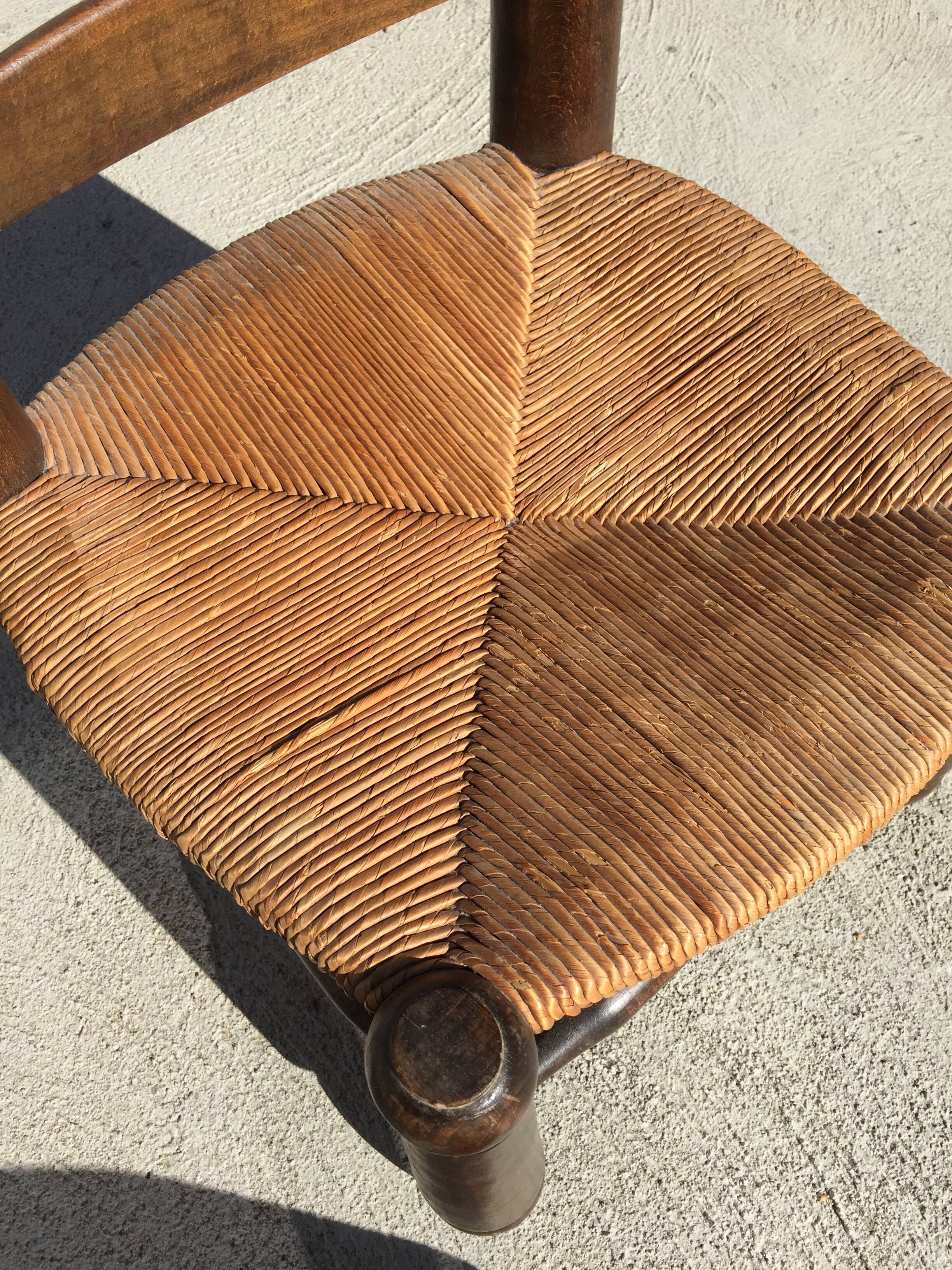 Straw low chair in the style of Charles Dudouyt