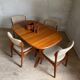 Vintage oval teak Scandinavian table with a central star base from Glostrup.