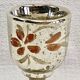 Painted blown glass egg cup with mercury gilding, 19th century.