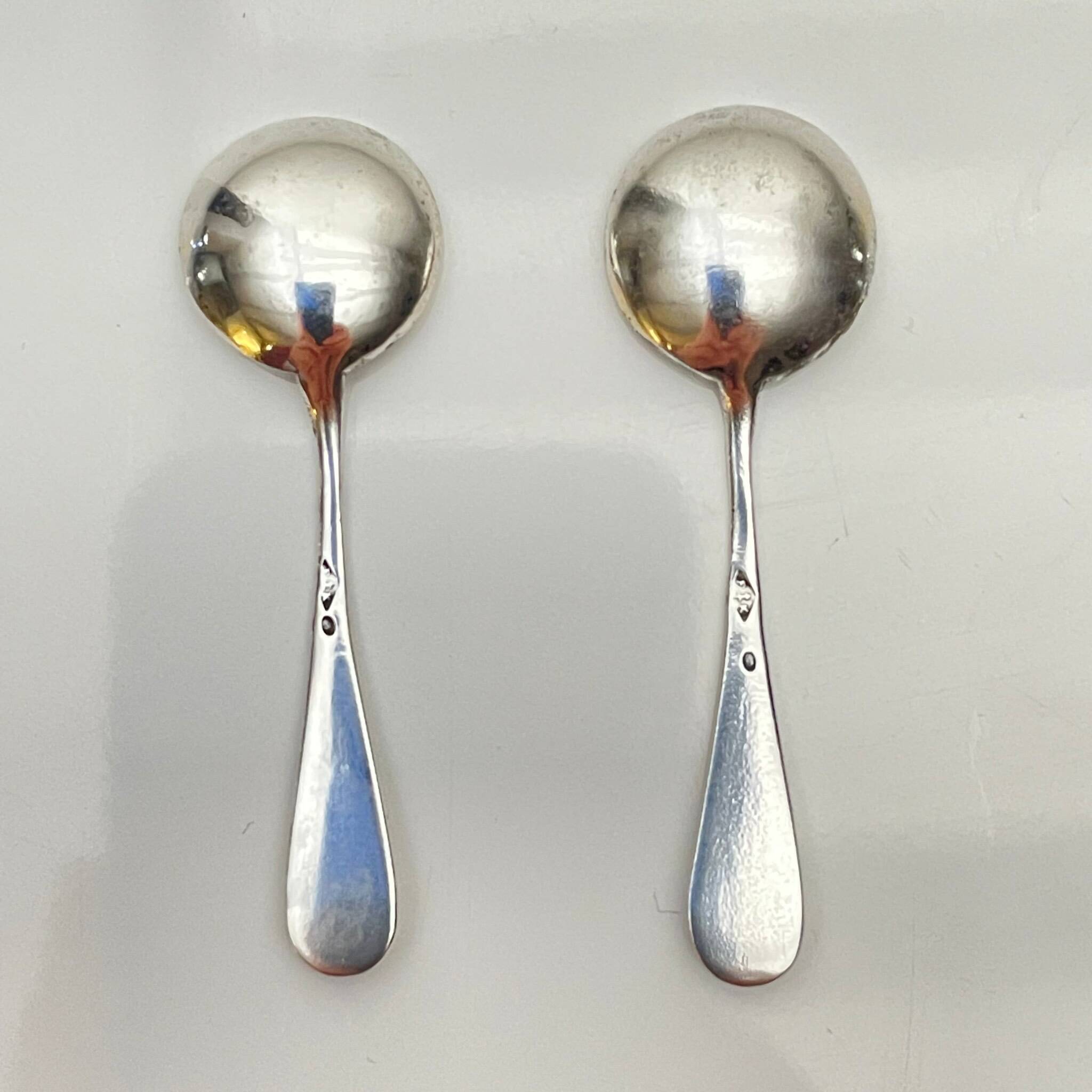 Pair of silver salt cellars and spoons