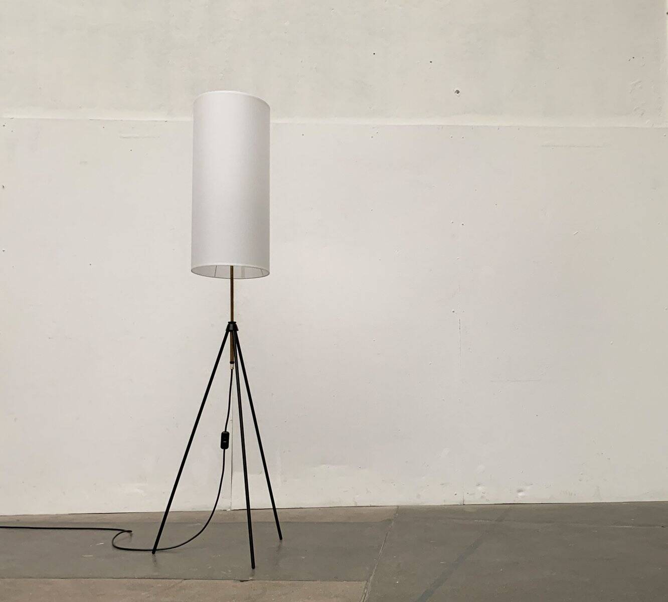 Mid-century minimalist tripod floor lamp, 1960s.