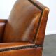 Sleek sheepskin Art Deco design armchair with beautiful details