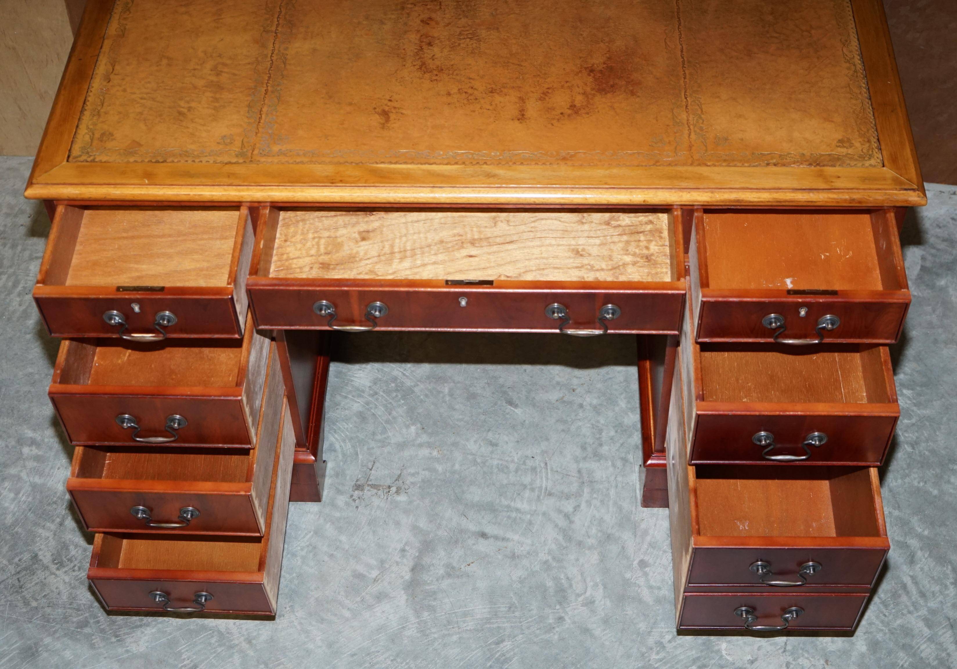 Vintage walnut desk with a leather top and two drawers.