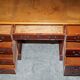 Vintage walnut desk with a leather top and two drawers.