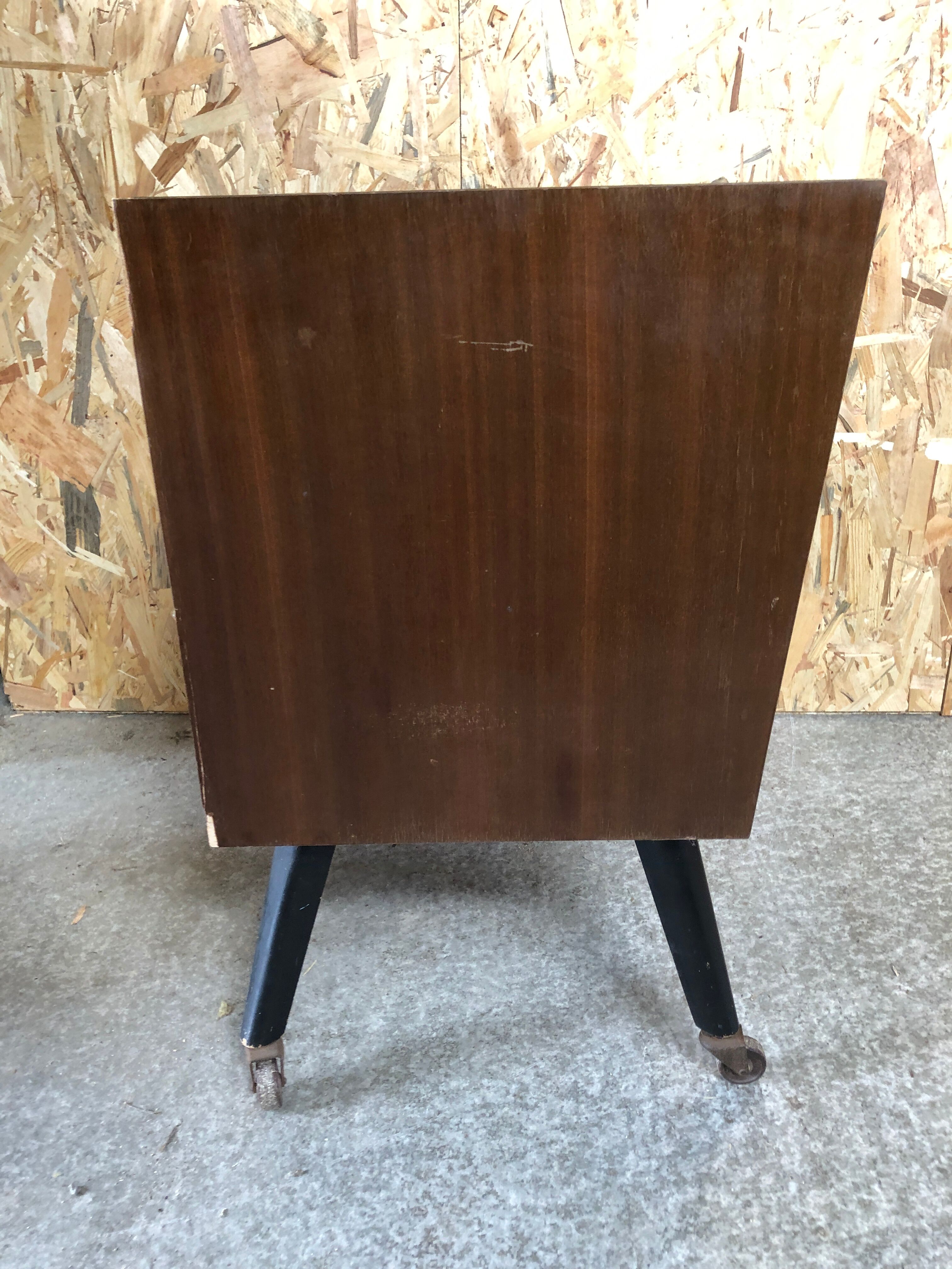 Old chest of drawers 4 drawers wood feet compass black + castors 70s vintage