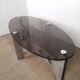 Table basse design vintage en alu brossé et plateau de verre.