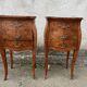Pair of bedside tables with bombé shape, marquetry, and bronze in Louis XV style.