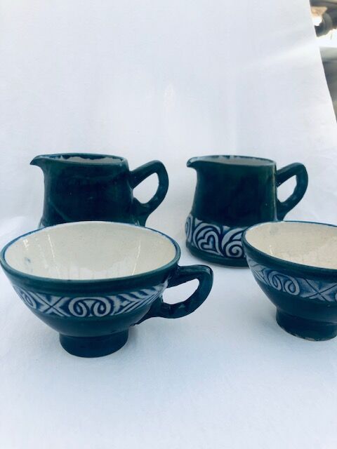 Two cups and two quimper milk jars