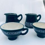 Two cups and two quimper milk jars