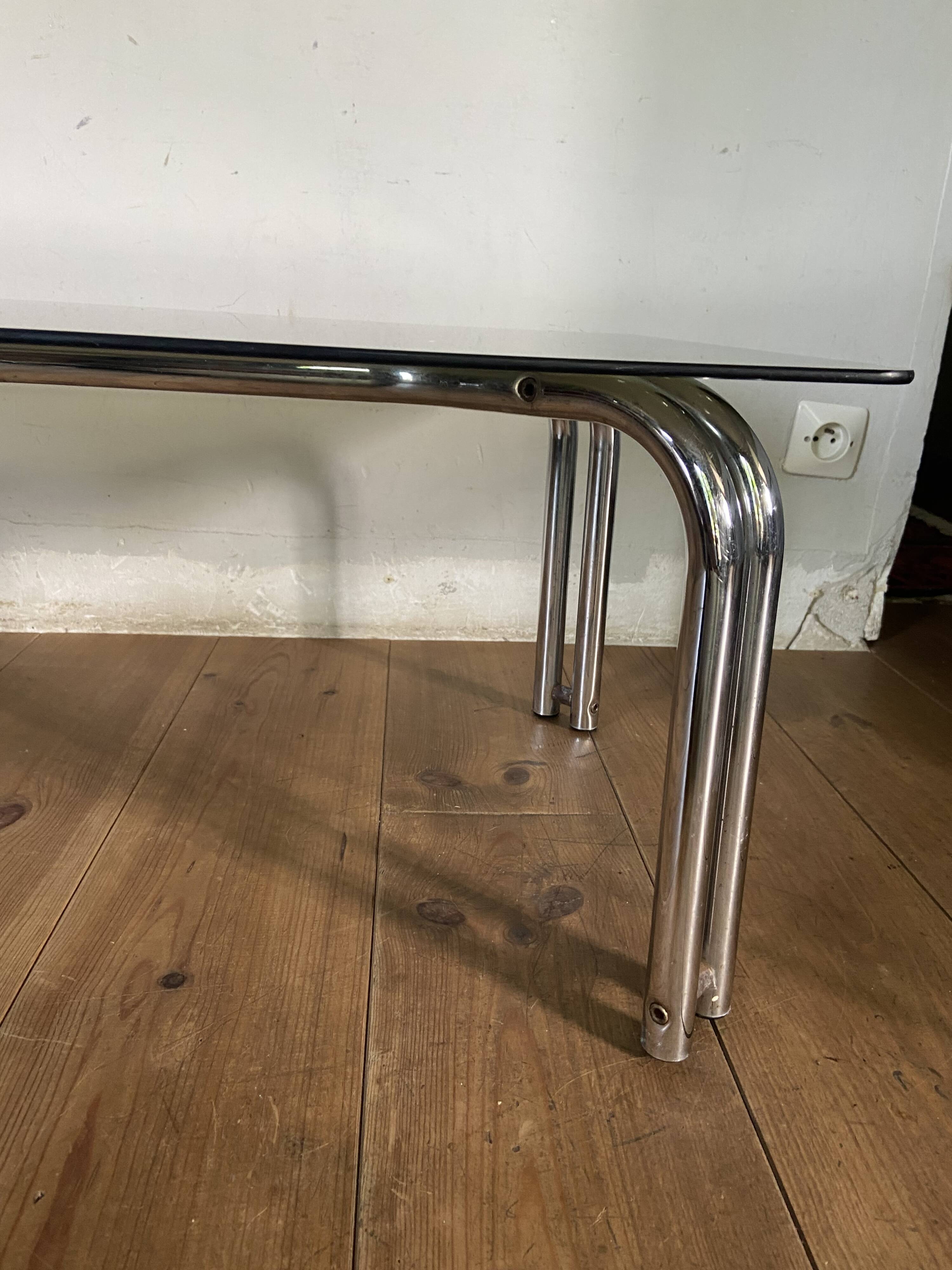 Vintage 70s table in tubular chrome and smoked glass