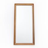 Mirror in a gold frame.