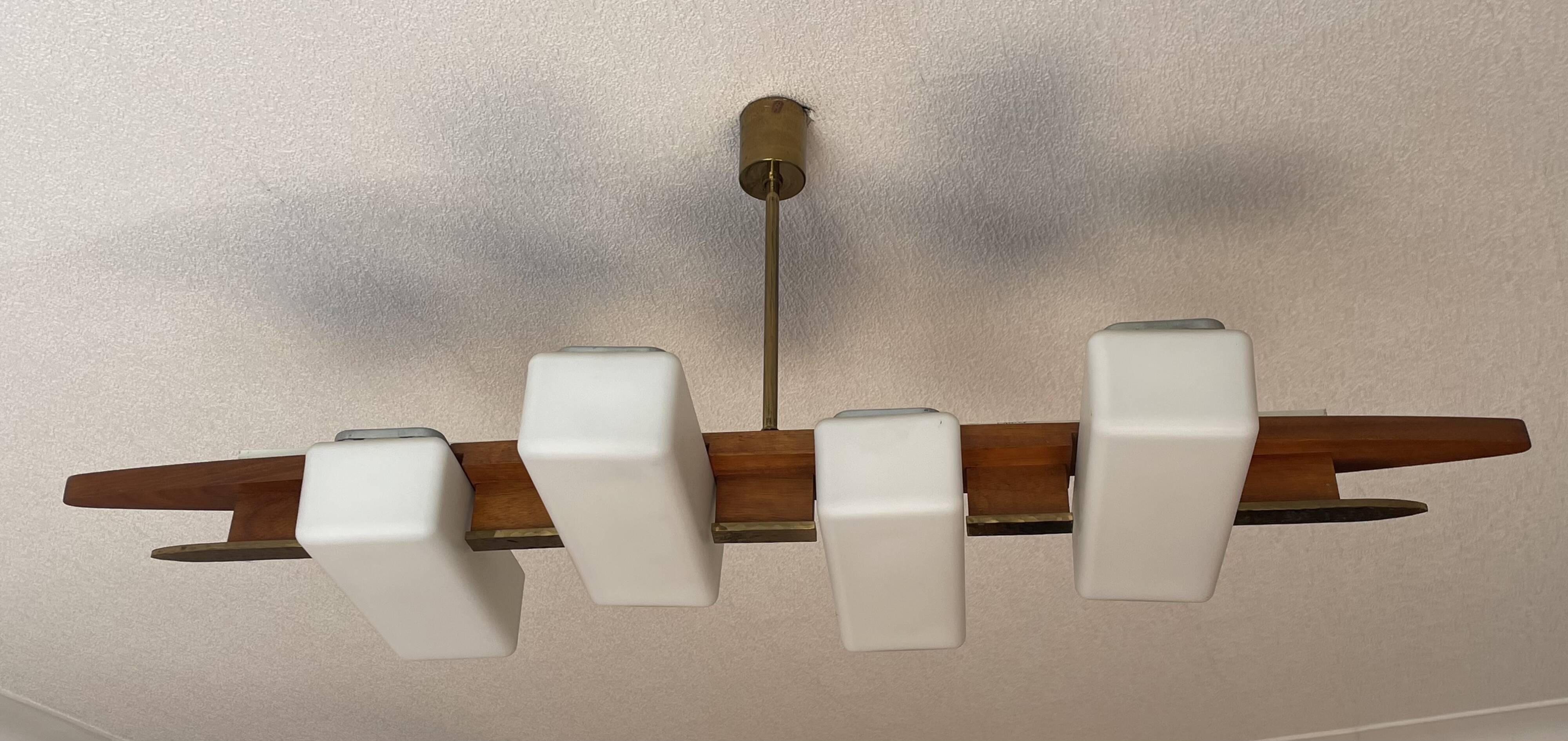 Scandinavian chandelier, brass, precious wood, 4 lights, shuttle 102 x 35 x 9 cm