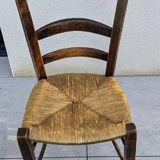 4 mismatched wood and straw chairs
