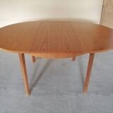 Teak round table with extension cords