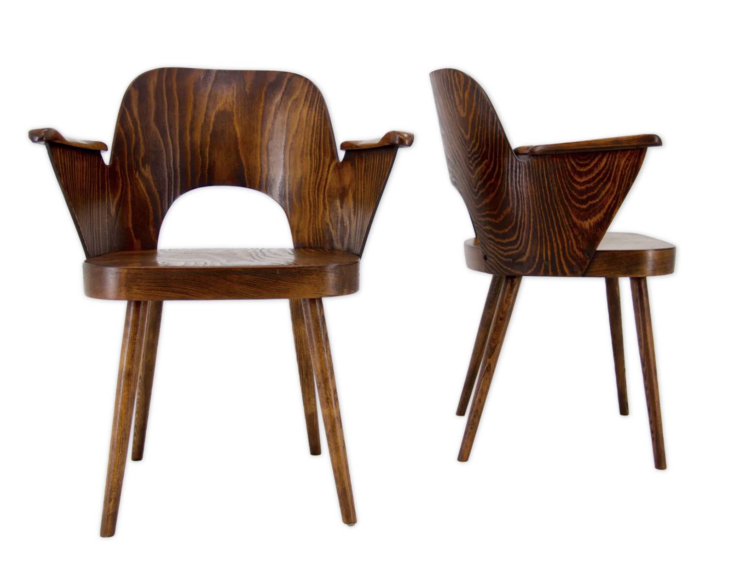Pair of curved wooden shell armchairs in the style of Oswald Haerdtl.