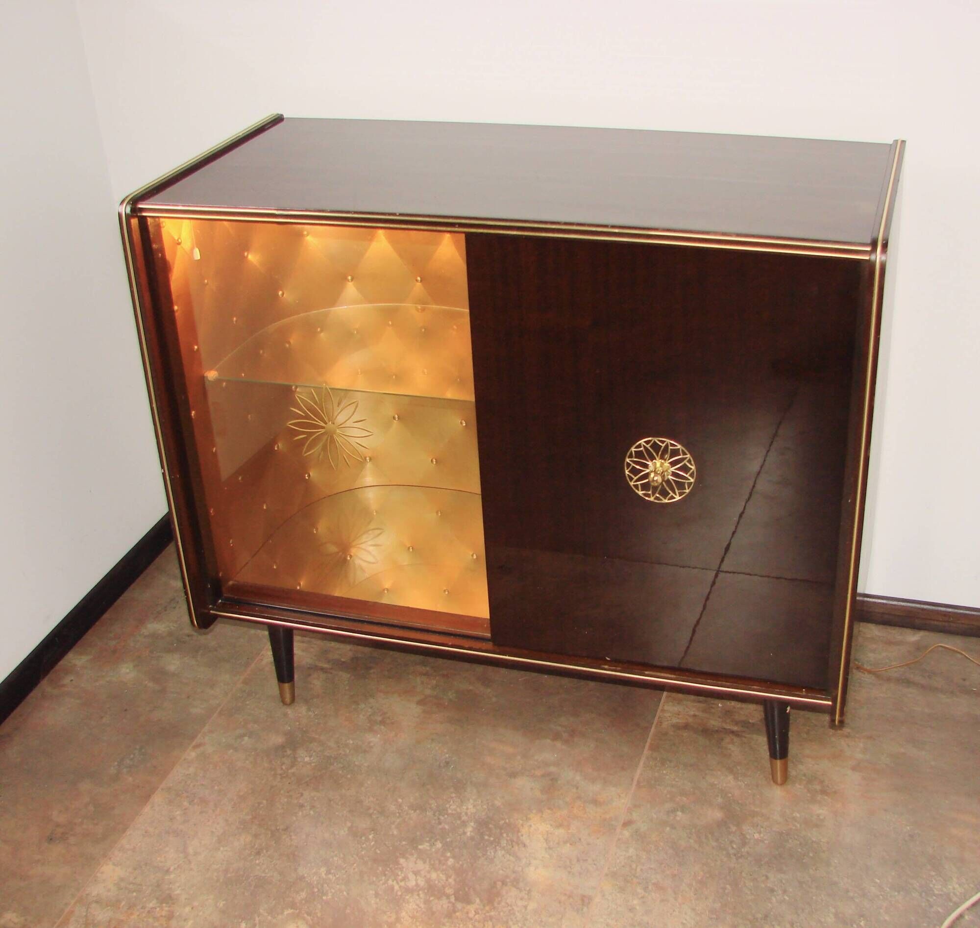 A vintage cabinet with a record player and a bar, 1960s.