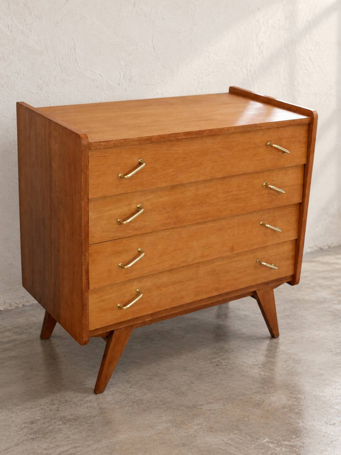 Vintage 1960s commode with tapered legs.