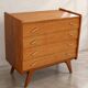 Vintage 1960s commode with tapered legs.