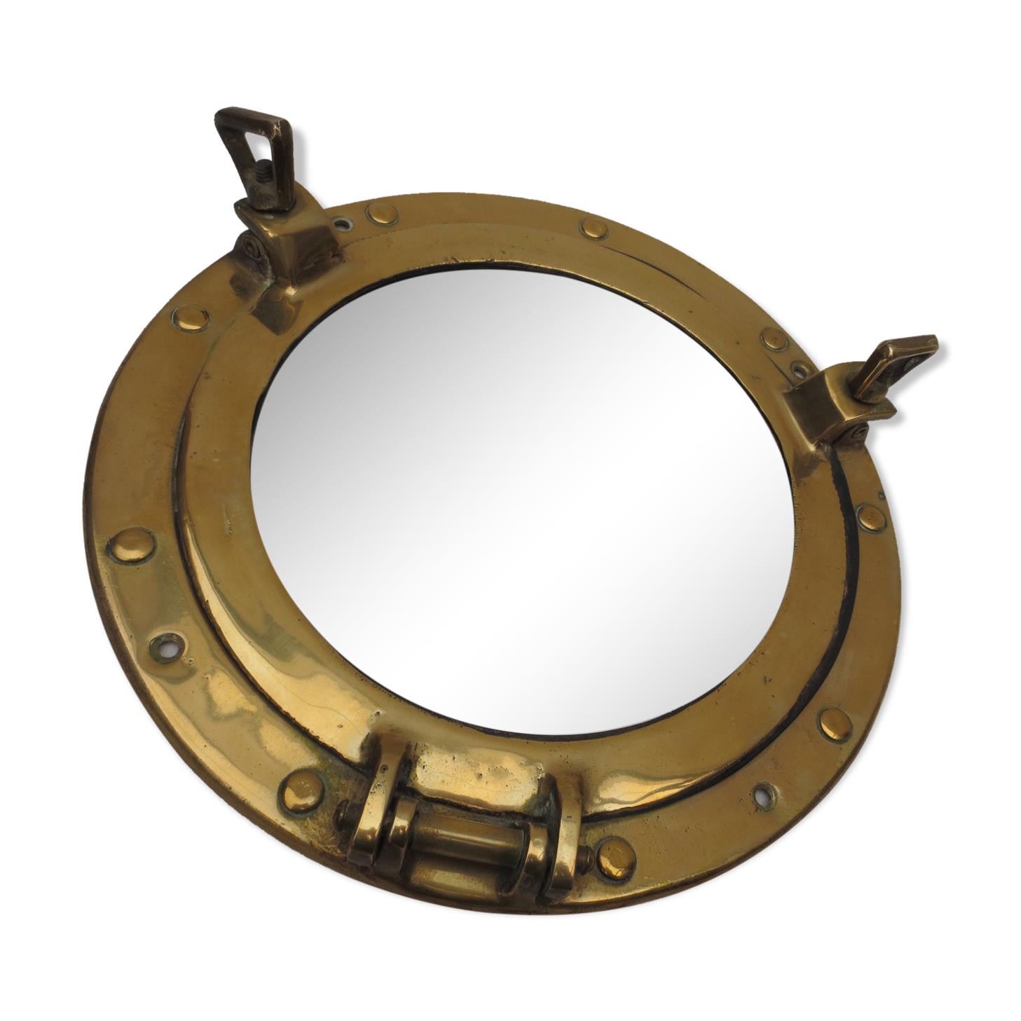 Mirror integrated into a brass navy porthole
