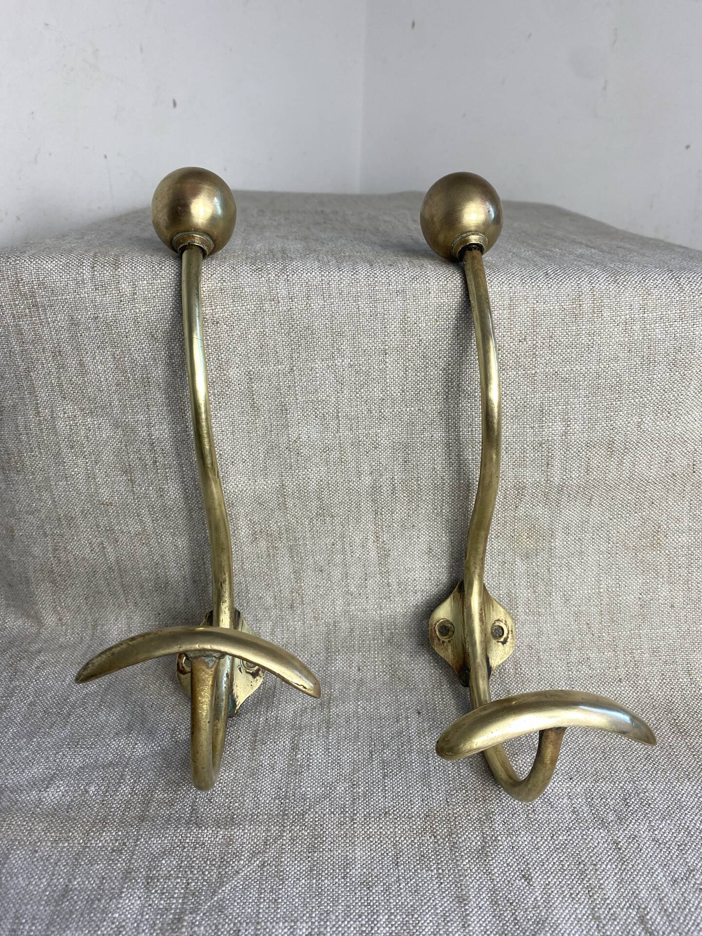 Pair of ball and hook coat hooks in brass