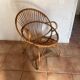 Rattan armchair with vintage design armrests
