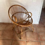 Rattan armchair with vintage design armrests