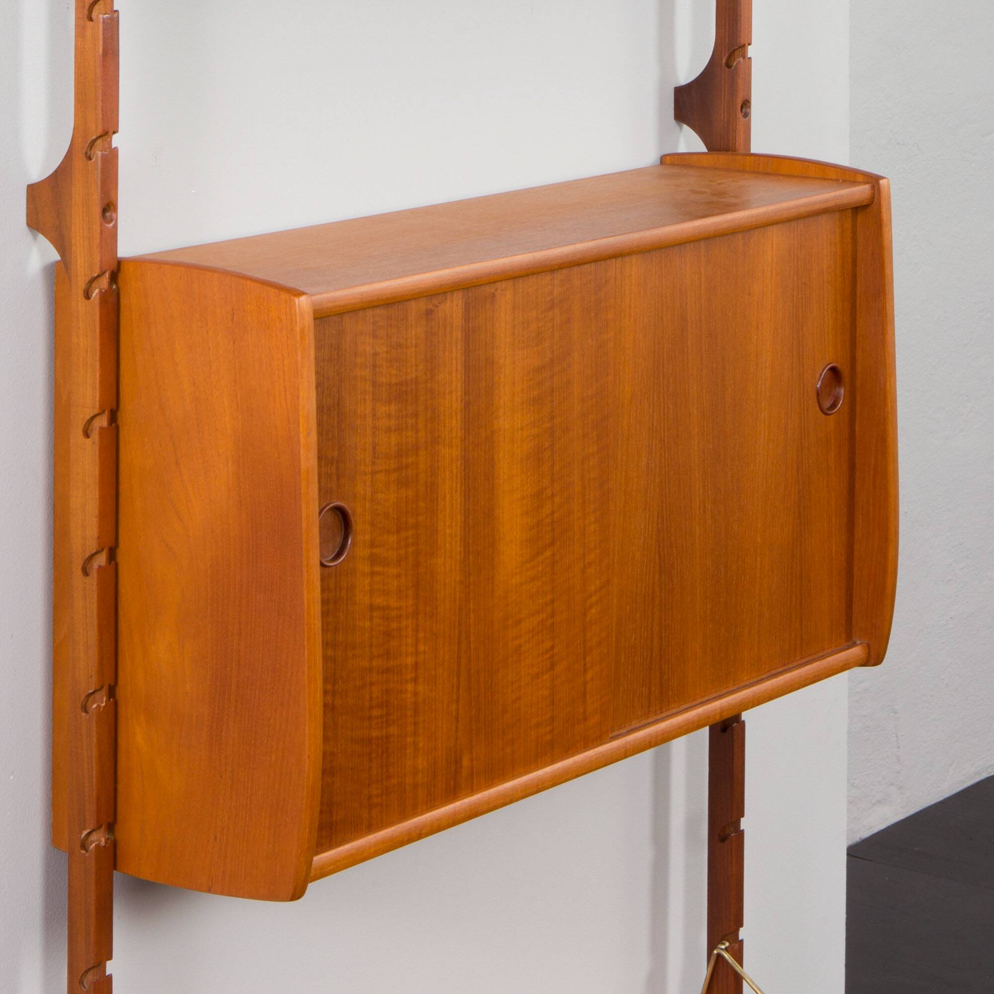 Scandinavian modern wall shelving system Ergo in teak by J. Texmon, Norway, 1960s