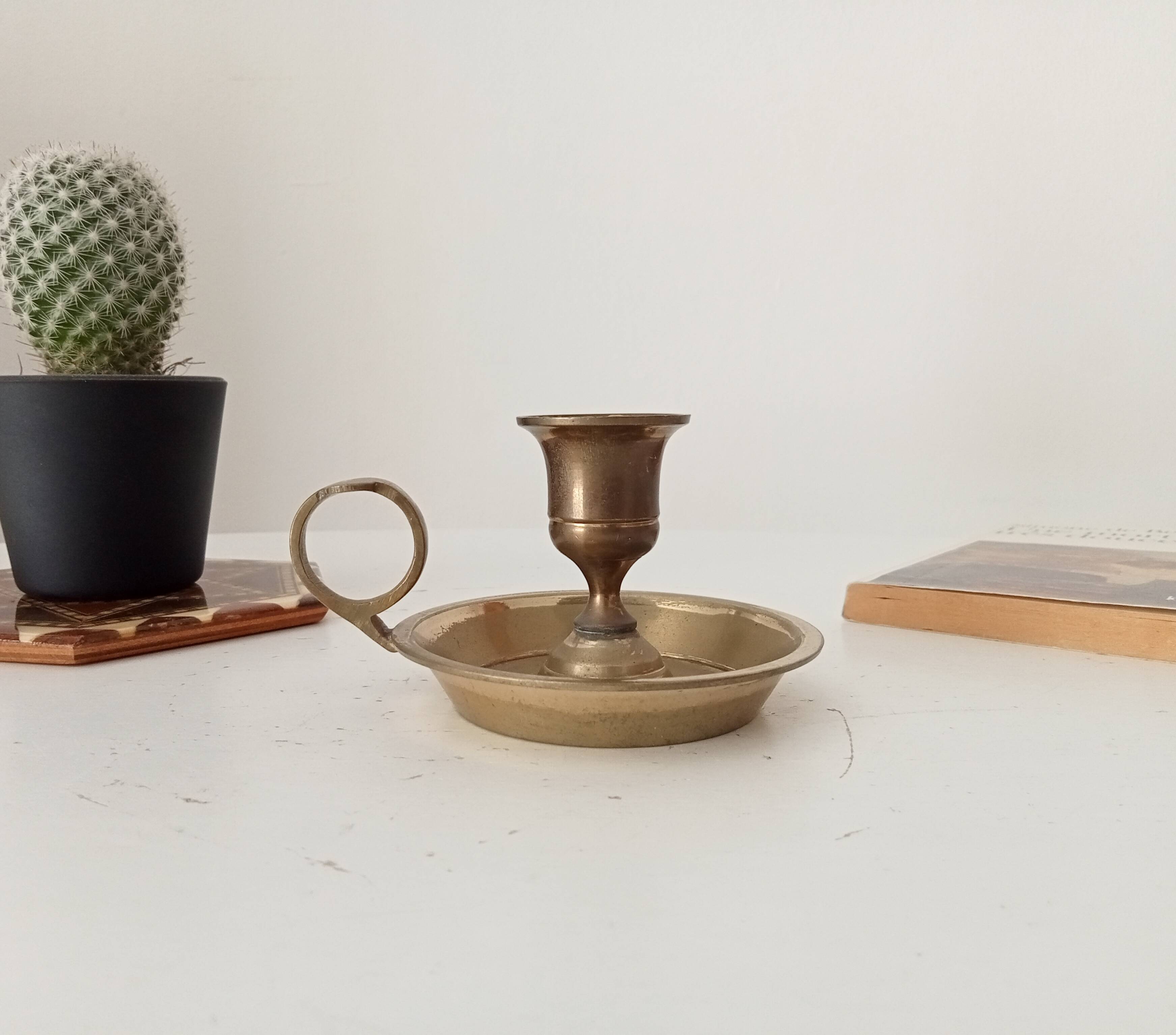 Vintage brass candle holder in gold.