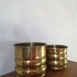 Duo of brass pot covers