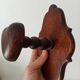 Vintage wall coat rack in carved solid wood, popular art.