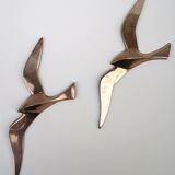 Stylized brass birds