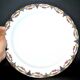 Round dish in Limoges porcelain - W. GUERIN & Cie 1900 - decoration floral garlands