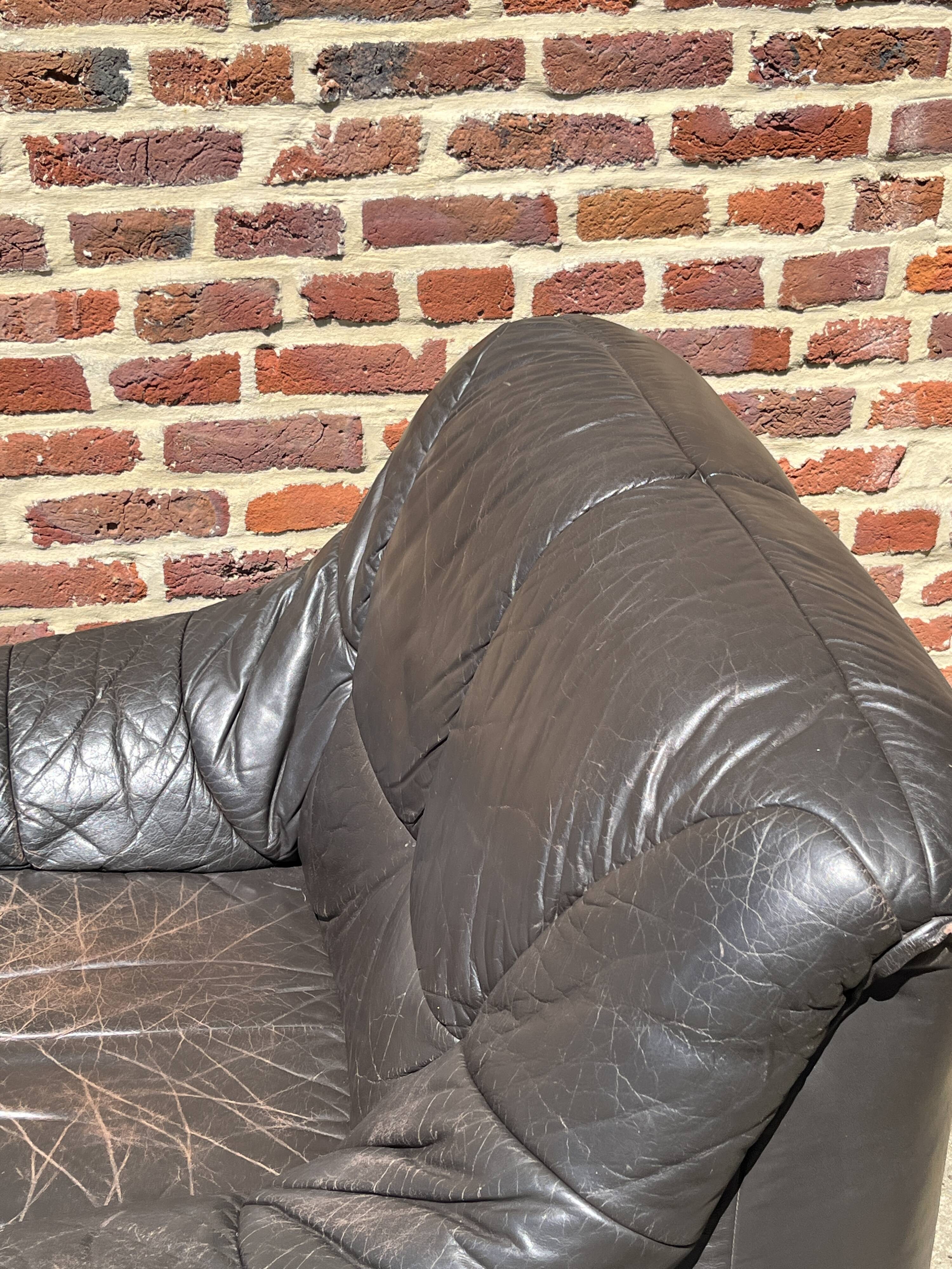 Pair of patinated leather club armchairs
