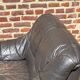 Pair of patinated leather club armchairs