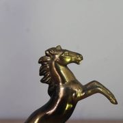 Pair of vintage bookends with rearing horses in gilded metal on marble bases.