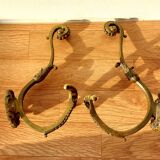 Pair of gilded bronze hooks Louis XVI style, nineteenth century.