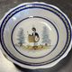Large centrepiece table dish in earthenware with a painted decoration of a drummer.