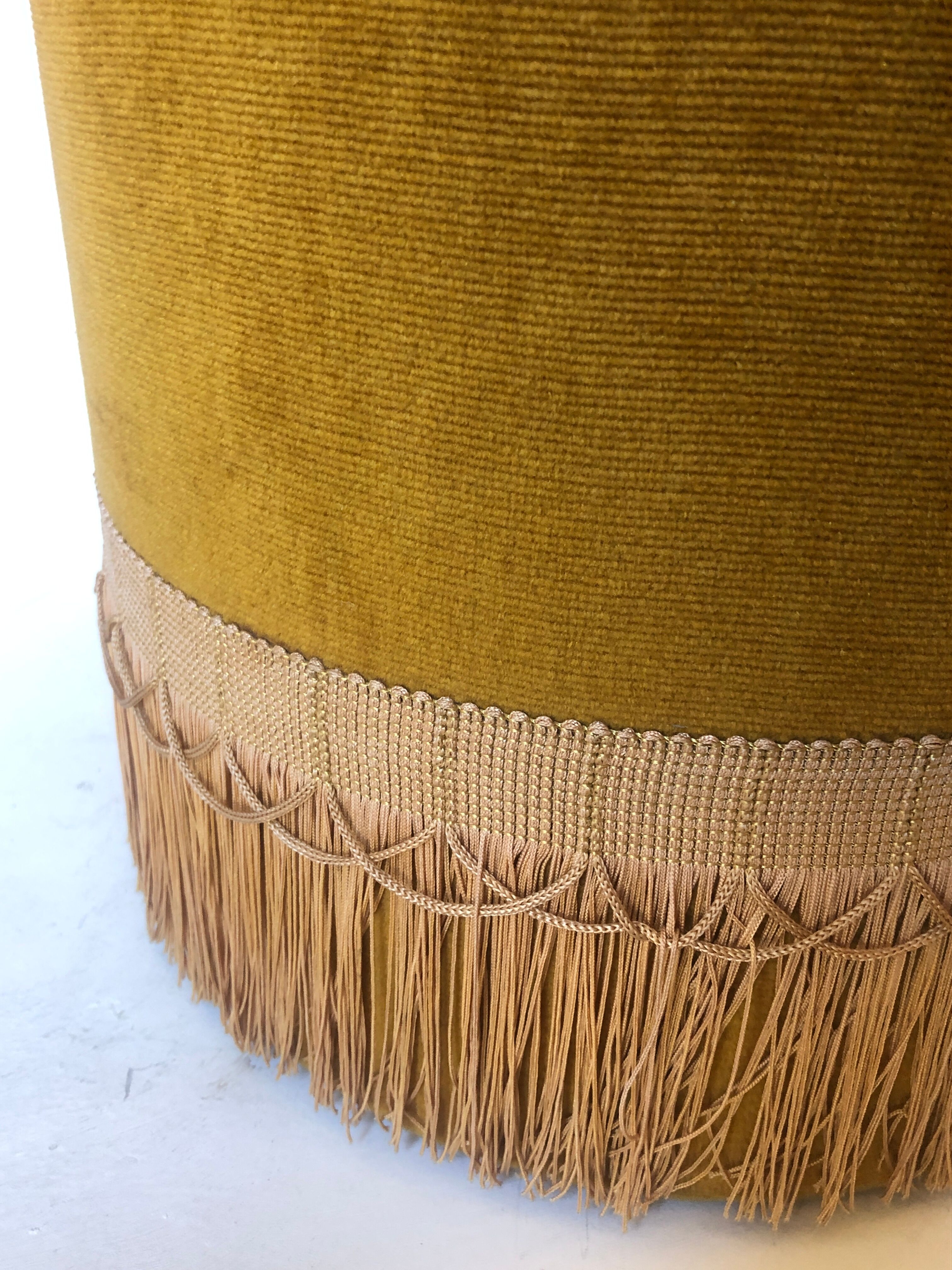 Velvet and fringed ottoman