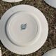 Set of 8 mismatched iron earth flat plates
