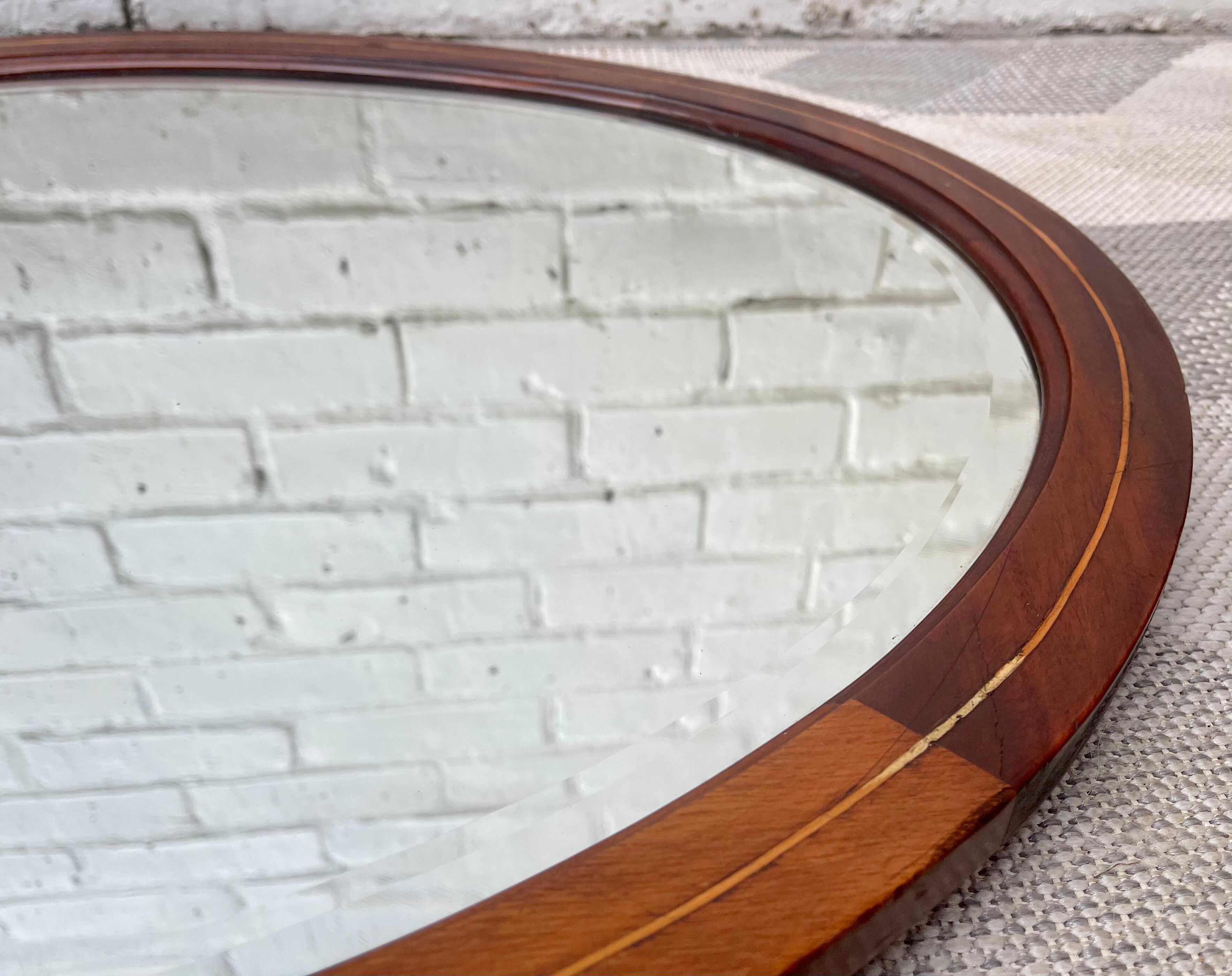 Vintage oval bevelled mirror mahogany frame
