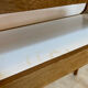 Small contemporary console in stained walnut wood.