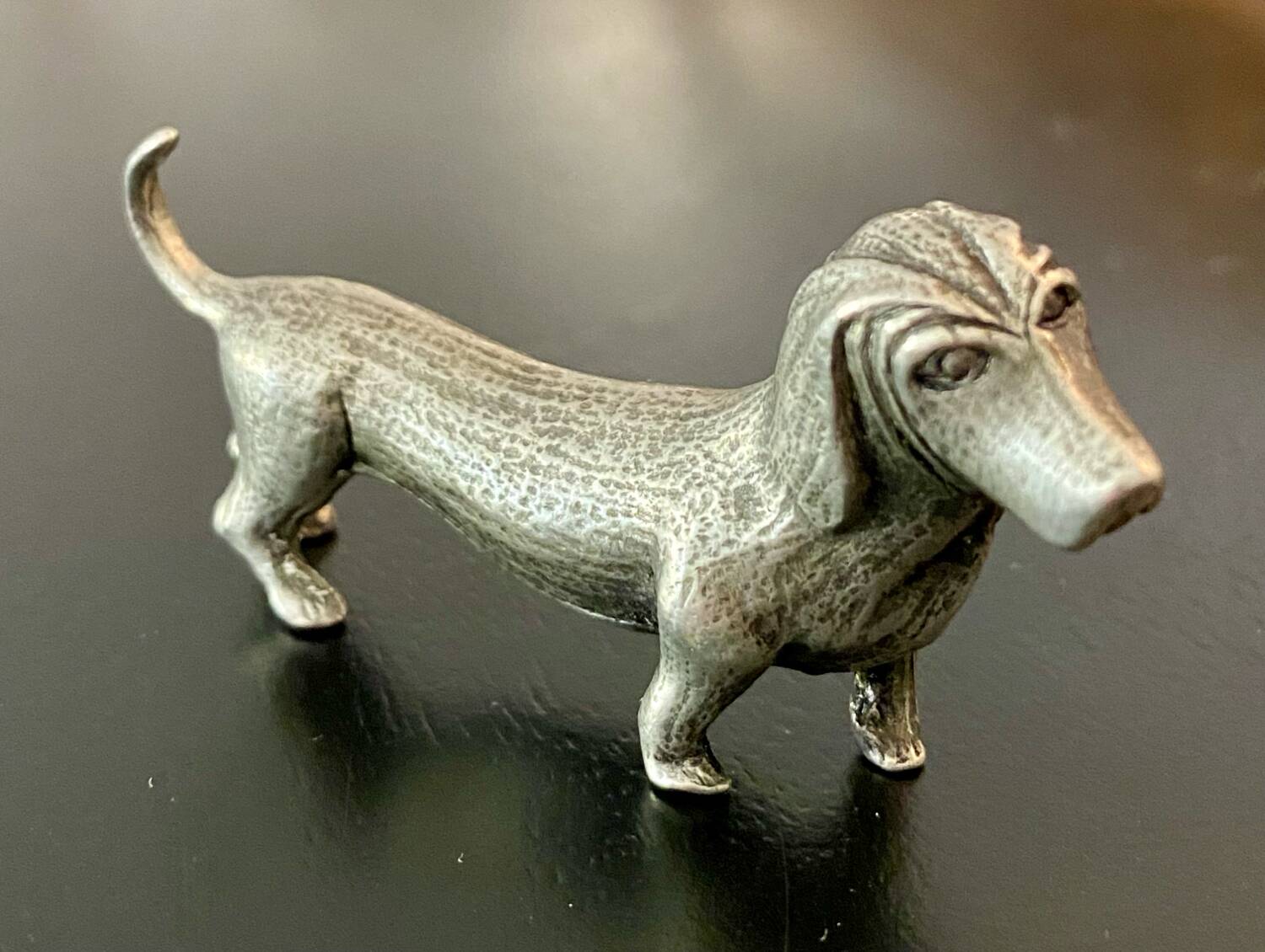 12 old dog-shaped Etains du Manoir knife holders
